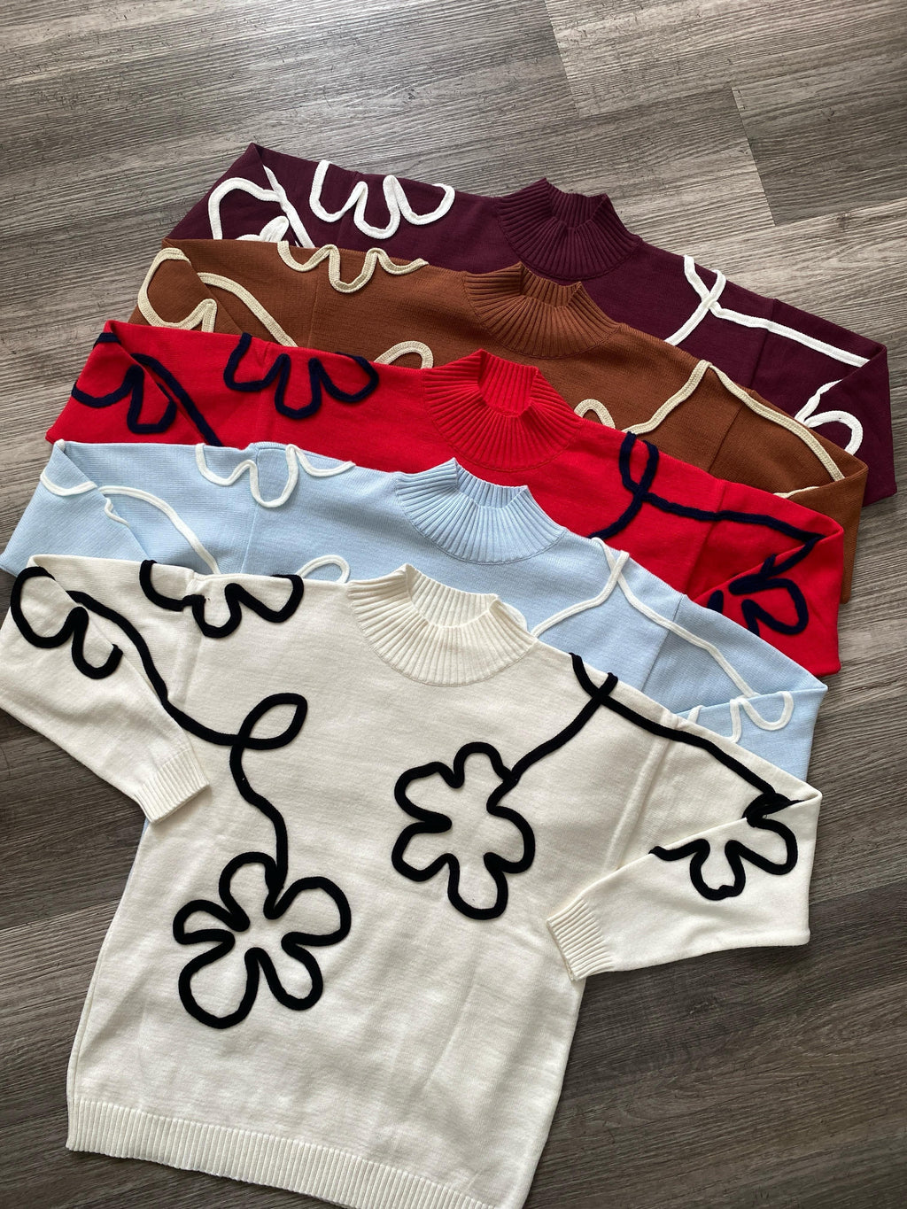 Suéter flor bordada